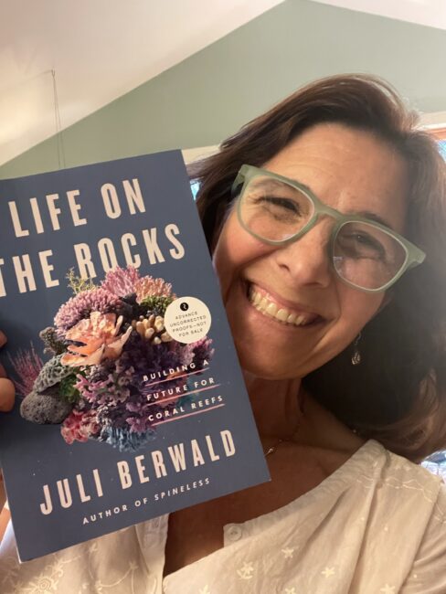 Juli holding galley of Life on the Rocks
